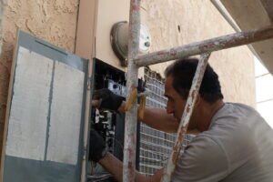 Electrician installing and upgrading an electrical panel in Los Angeles, CA.