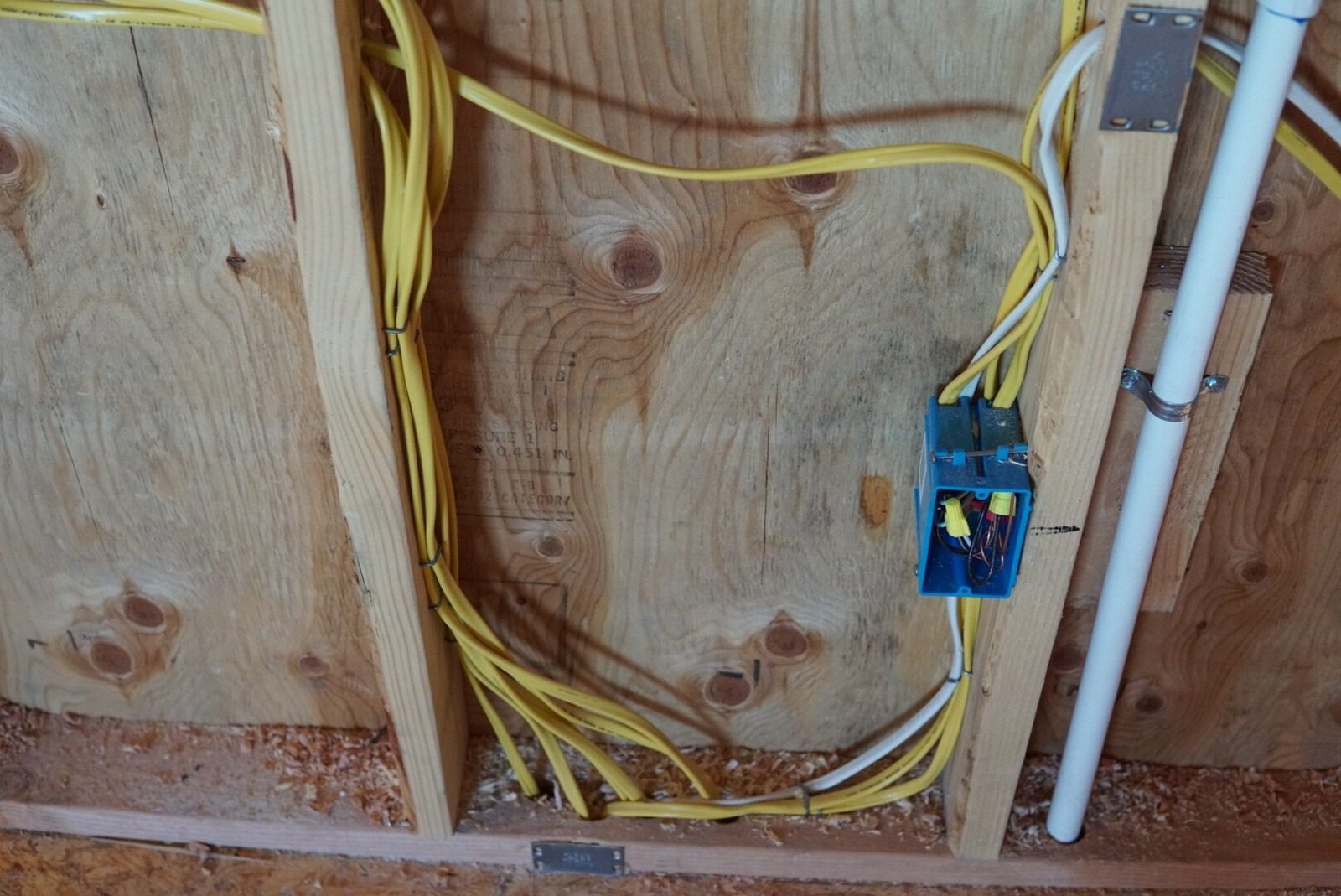 Rewiring and GFCI outlet installation showcasing organized wires and professional electrical work.
