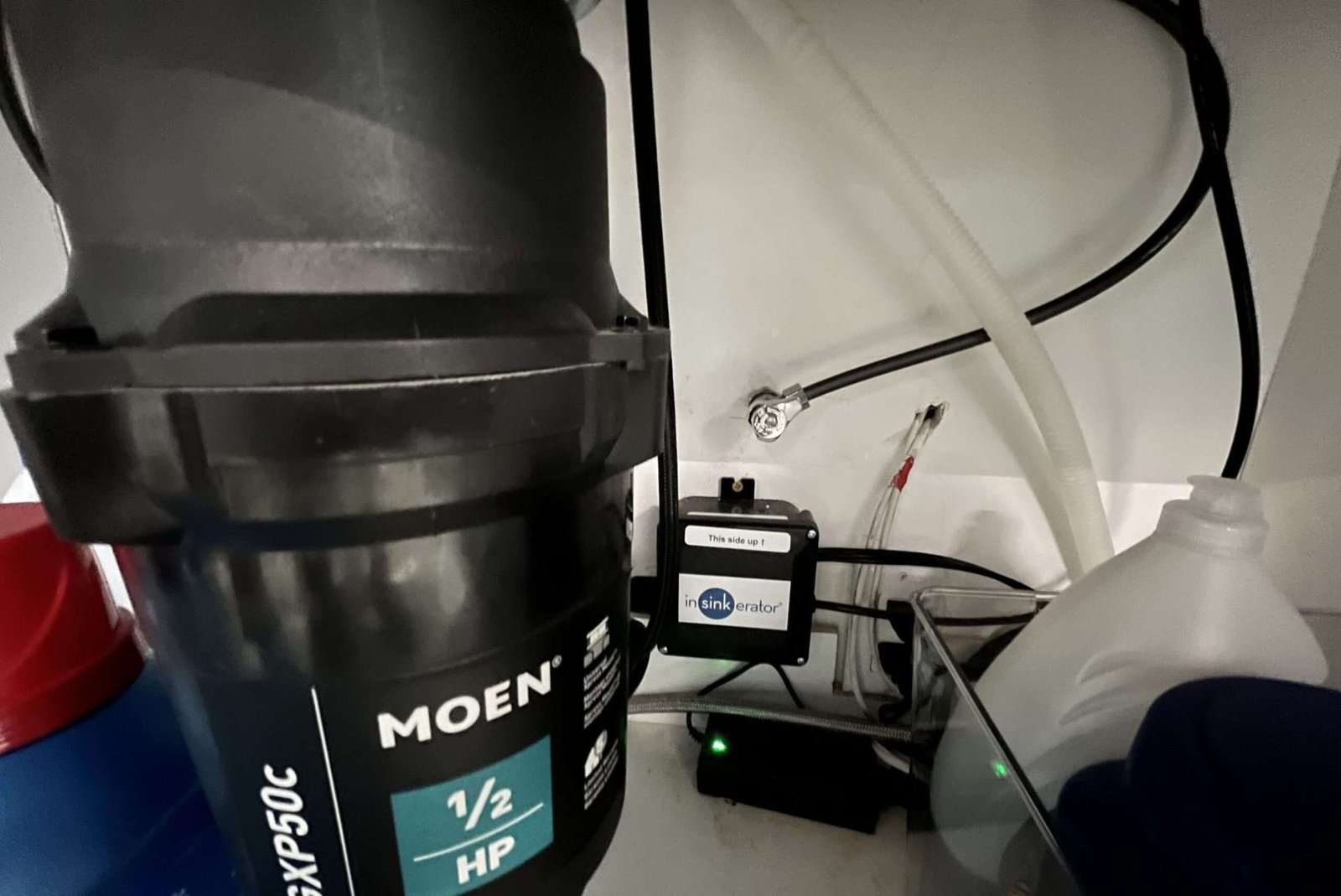 Installed garbage disposal wiring with a dedicated switch for safe and efficient kitchen use.